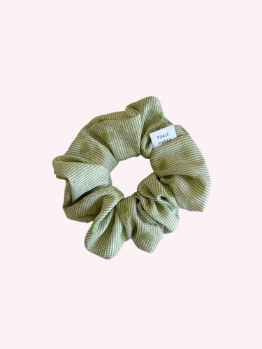 Green checkered scrunchie on a white background